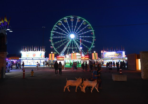 Carnival rides light up the night ...