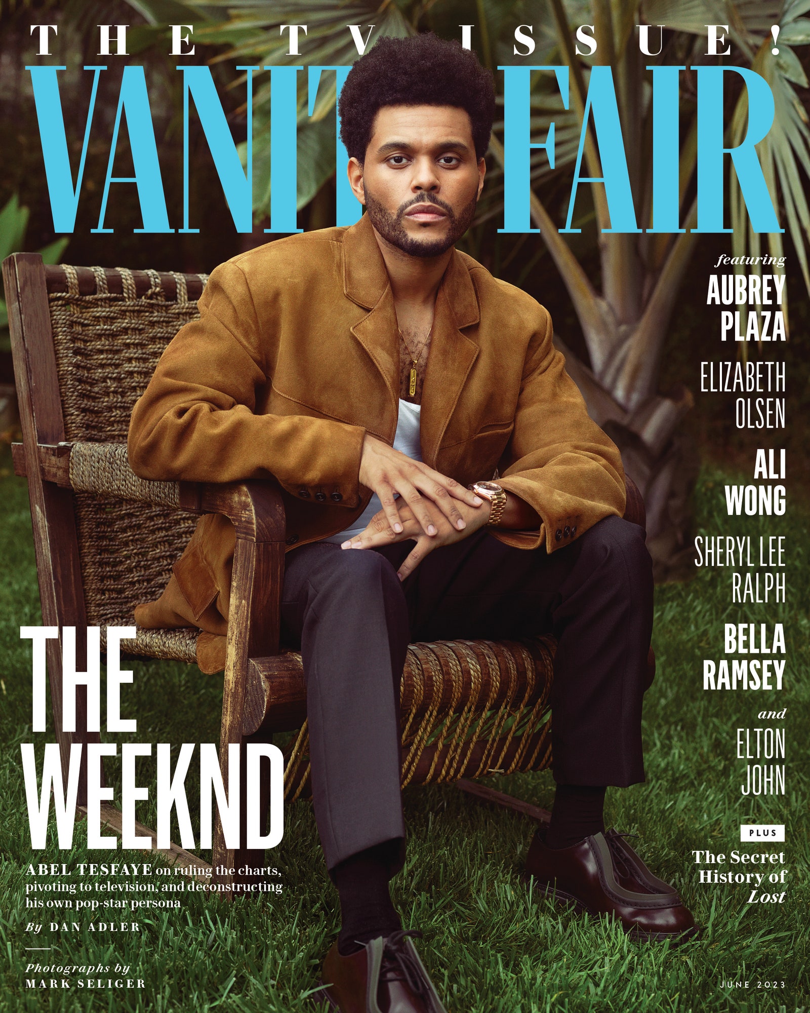 Abel “The Weeknd” Tesfayes sits on a chair outdoors wearing Prada.