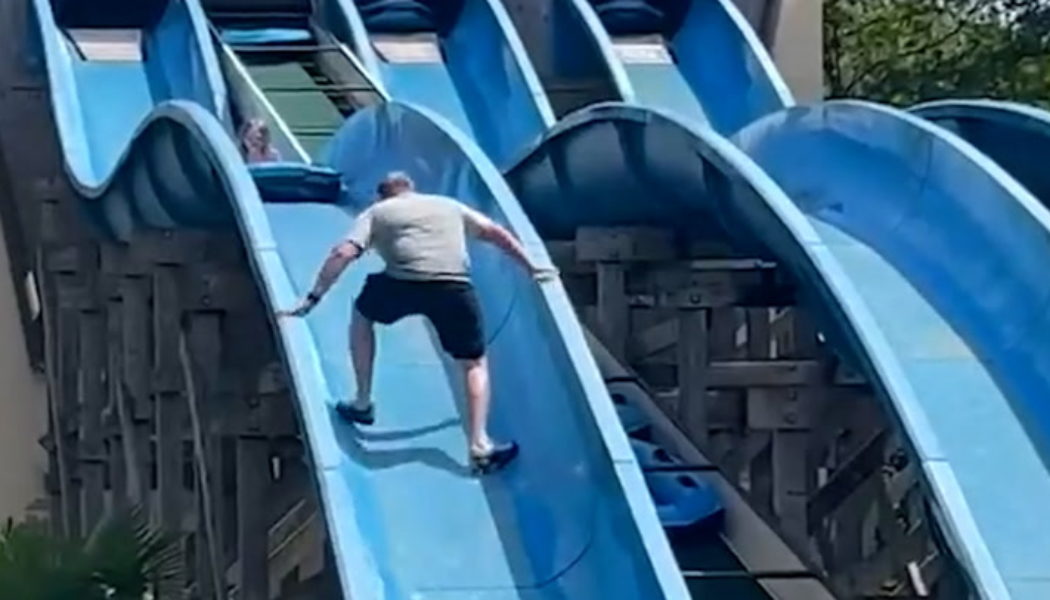 ‘Heroic’ father scales theme park water slide to rescue stuck daughter