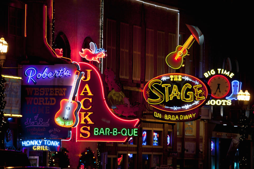 neon signs on broadway at night