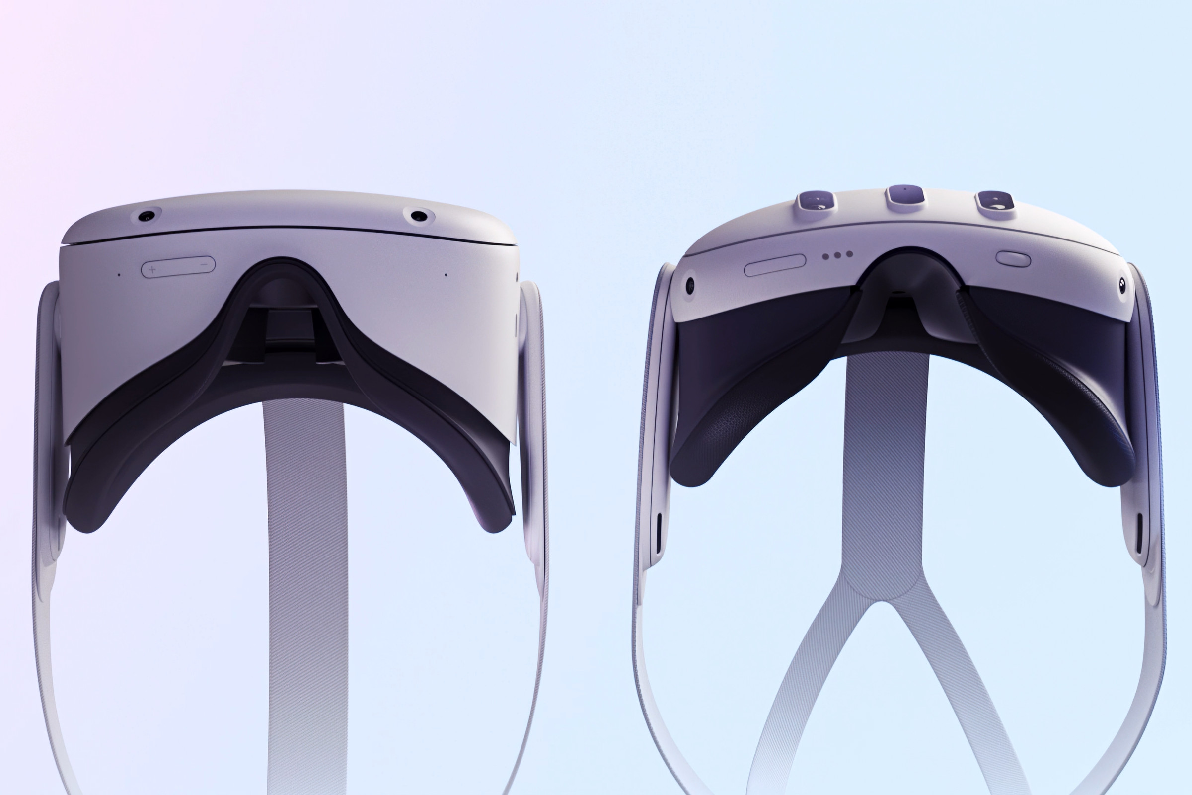 Side-by-side view from the bottom of both the Meta Quest 2 and Quest 3 headsets showing the new version’s slimmer design.