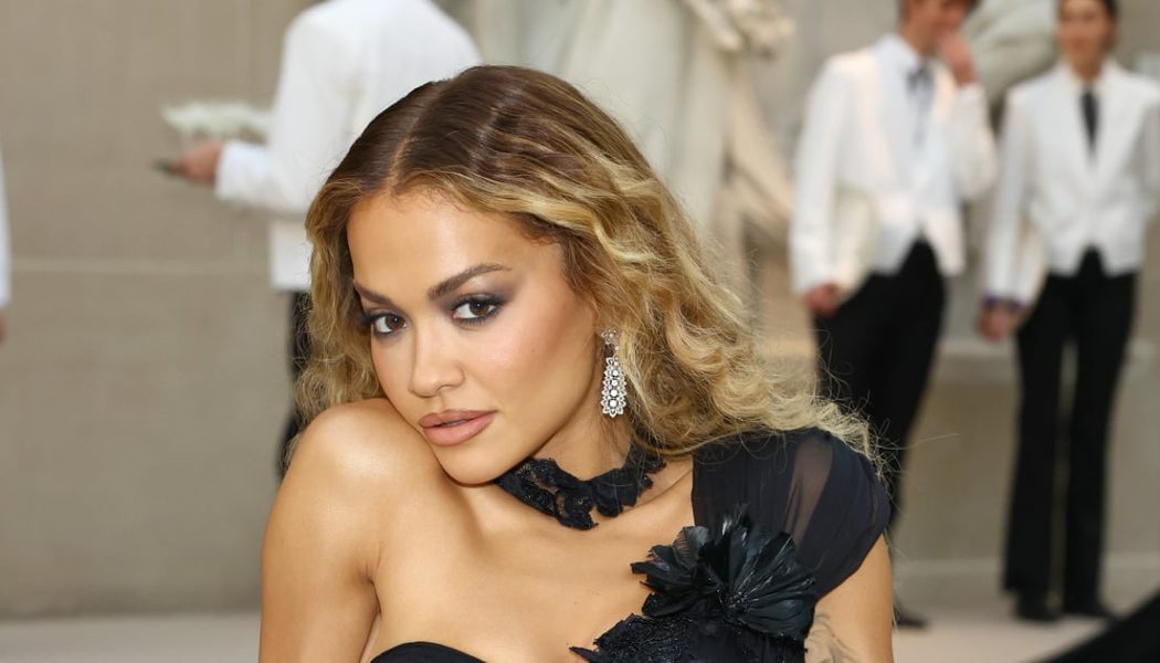 Rita Ora Looks Red Hot in a Plunging, See-Through Lace Dress Over String Lingerie