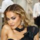 Rita Ora Looks Red Hot in a Plunging, See-Through Lace Dress Over String Lingerie