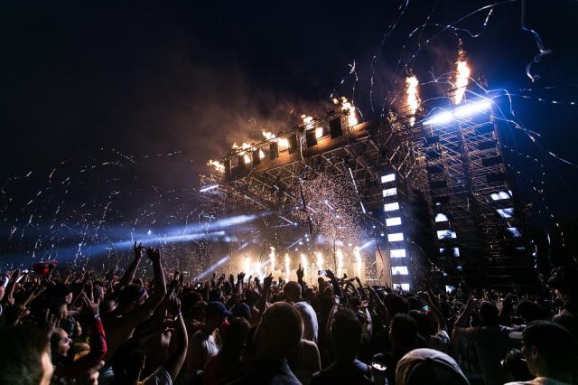 crowd looking at stage at a music festival