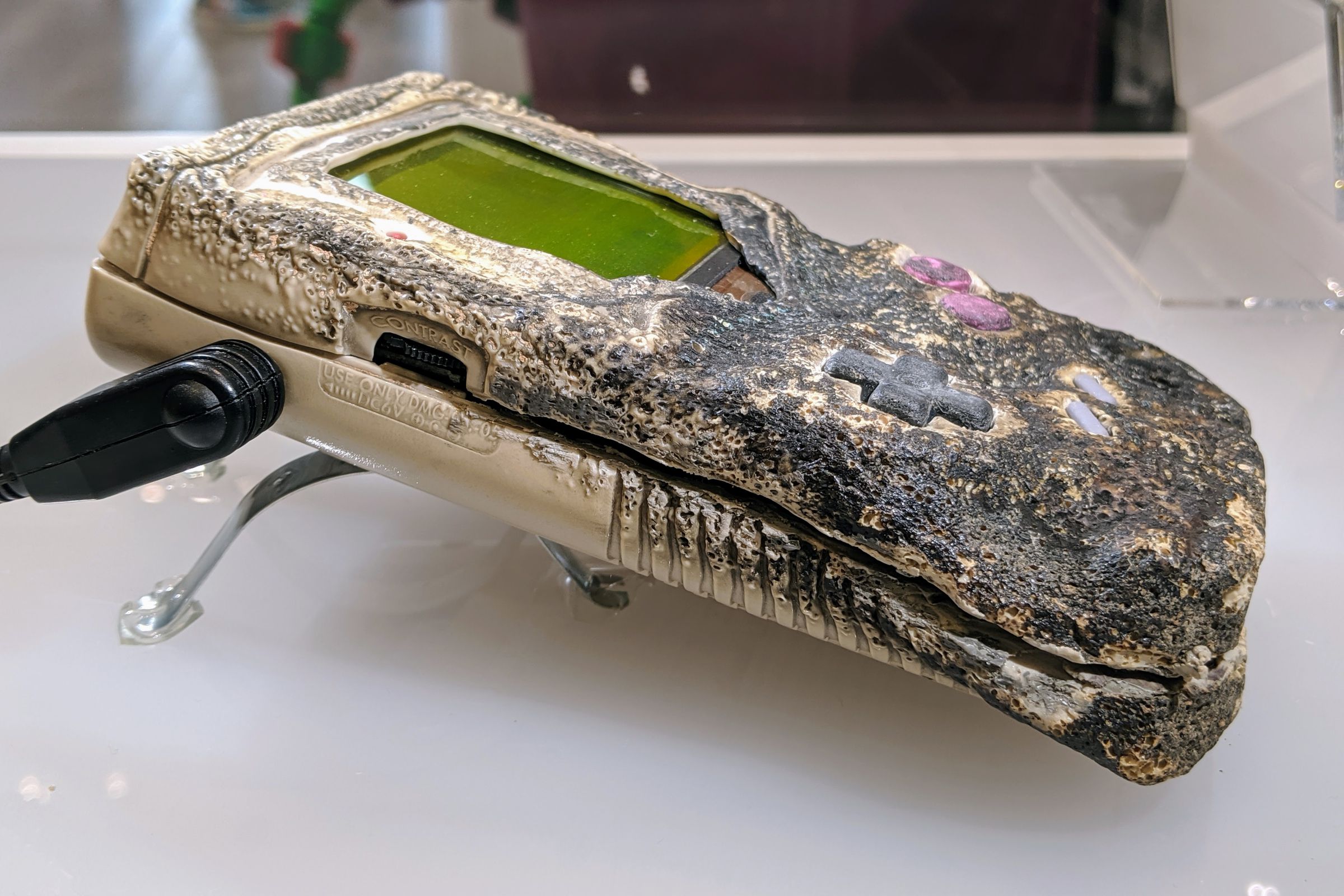 A half-charred Nintendo Game Boy that got damaged in a fire.