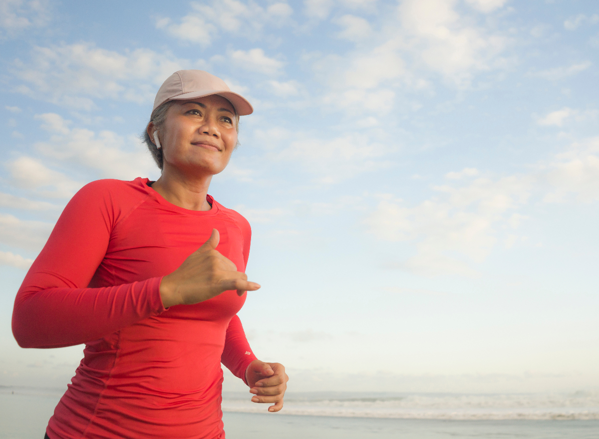 mature woman running on the beach