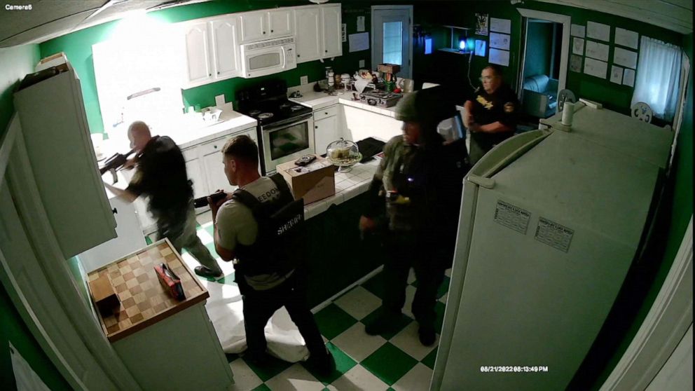 PHOTO: Security footage of police officers raiding the house of rapper Afroman last year.