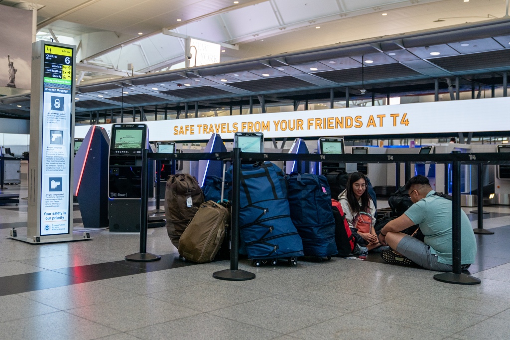 Travelers stranded at JFK Airport.