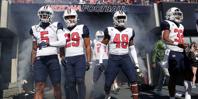 The Arizona Wildcats take the field before a game against Washington State