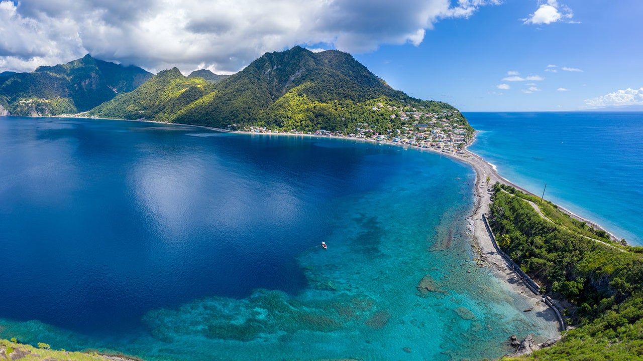 Scotts Head Village, Dominica, is seen on the far side of the island. On left side is the Caribbean Sea, on the right side is the Atlantic Ocean. (Derek Galon via Getty Images)