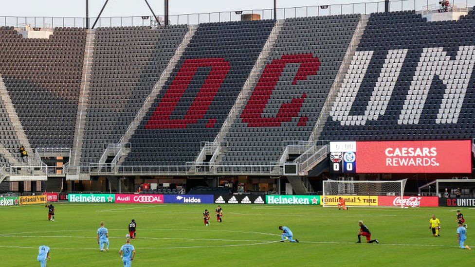 Players take a knee on the field in before the game between D.C. United and the New York City Football Club at Audi Field in Washington, D.C.,