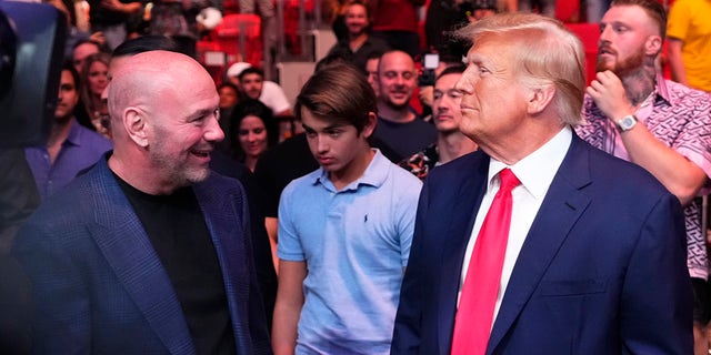 Donald Trump and Dana White look on