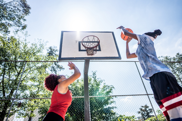 Women playing basketball