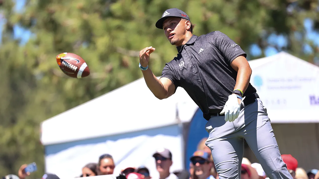 Patrick Mahomes tosses a football