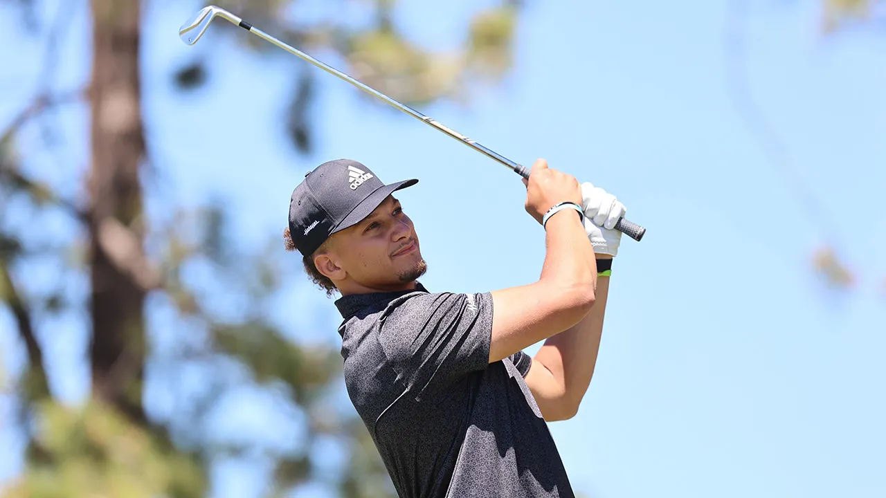 Patrick Mahomes hits off his tee