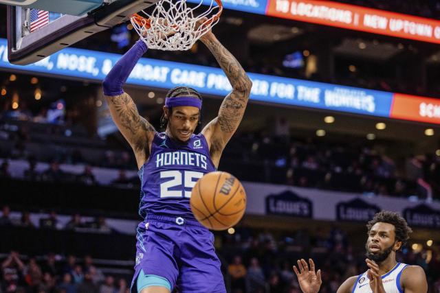 Charlotte Hornets forward P.J. Washington (25) dunks against the Golden State Warriors during the first half of an NBA basketball game Saturday, Oct. 29, 2022, in Charlotte, N.C. (AP Photo/Scott Kinser)