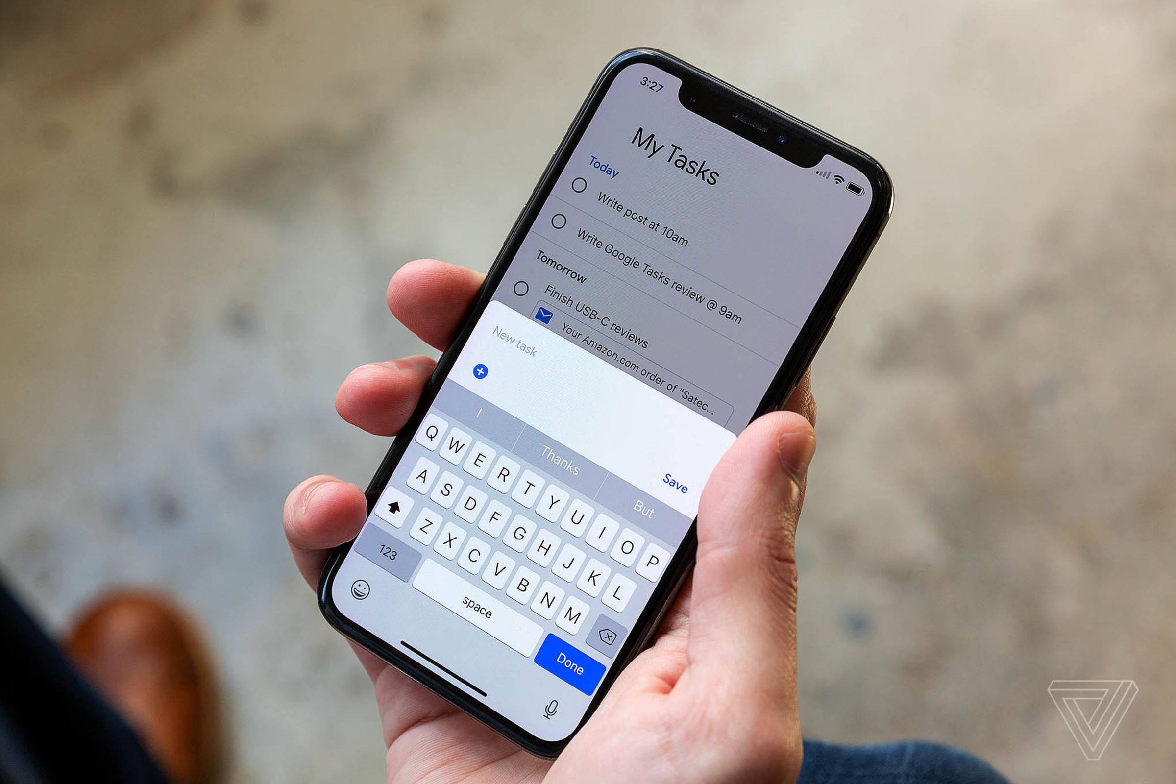 A phone showing Google Tasks on the screen