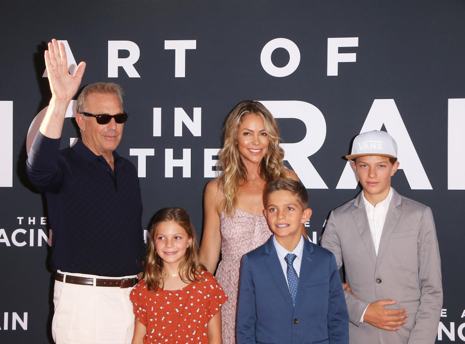 LOS ANGELES, CALIFORNIA - AUGUST 01: Kevin Costner, Christine Baumgartner and their children attend the Los Angeles premiere of 20th Century Fox&#39;s &quot;The Art of Racing In The Rain&quot; held at El Capitan Theatre on August 01, 2019 in Los Angeles, California. (Photo by Michael Tran/FilmMagic)