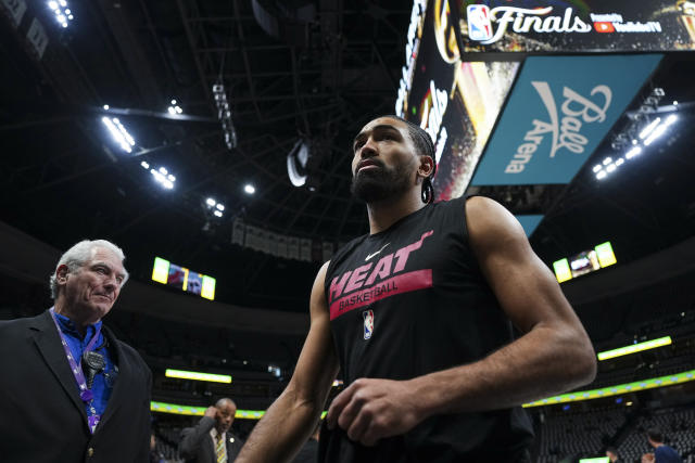 Miami Heat guard Gabe Vincent, right, walks off the court before Game 5 of basketball&#39;s NBA Finals against the Denver Nuggets, Monday, June 12, 2023, in Denver. (AP Photo/Jack Dempsey)