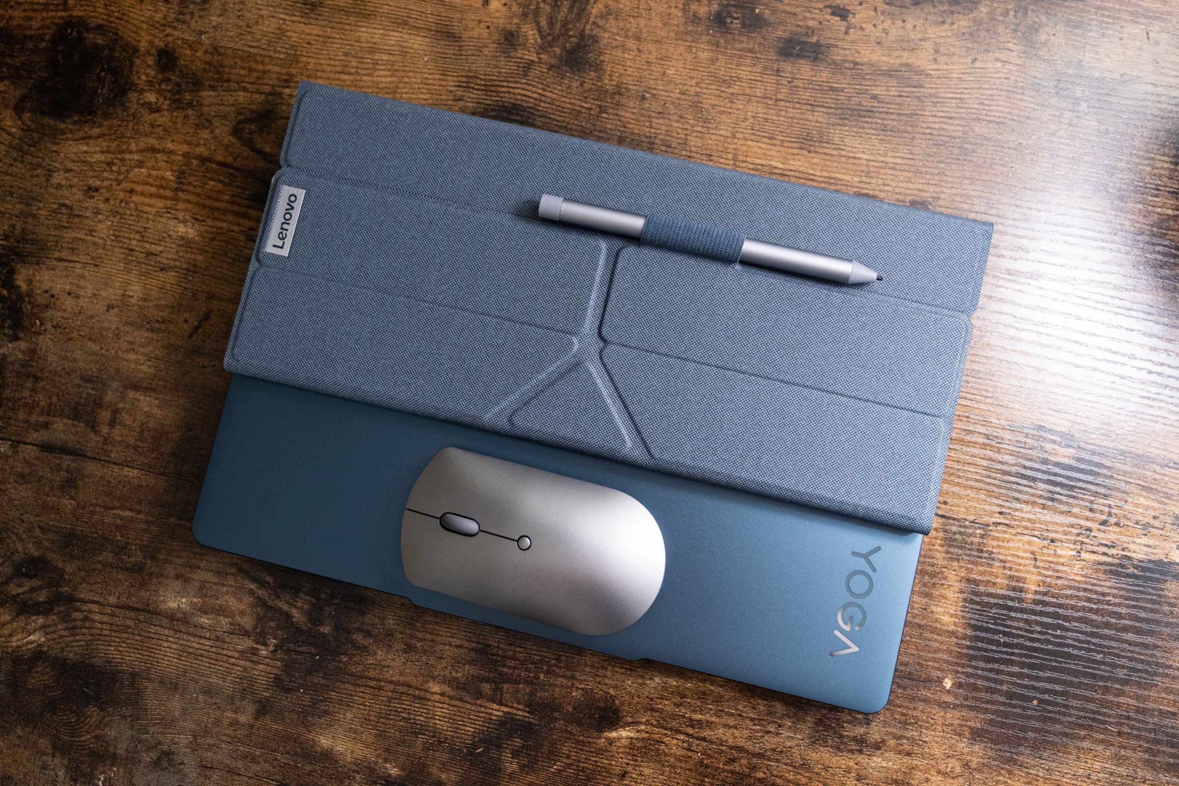 The Bluetooth keyboard, folding stand, mouse, and stylus that come included with the Yoga Book 9i.