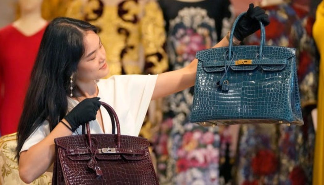 Luxury retail workers earn about $45,000 per year to sell handbags and jewelry that can cost more than their take-home pay