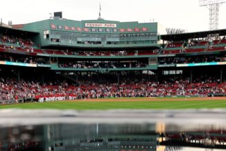 Red Sox fans take advantage of flooded Fenway Park during rain delay