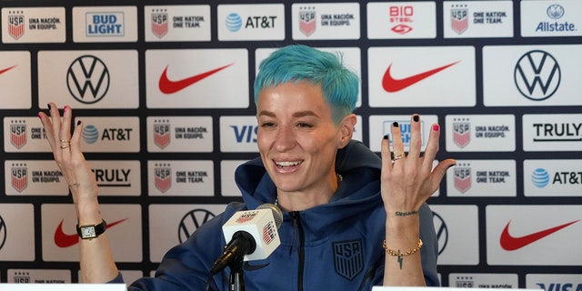 Megan Rapinoe talks to the media