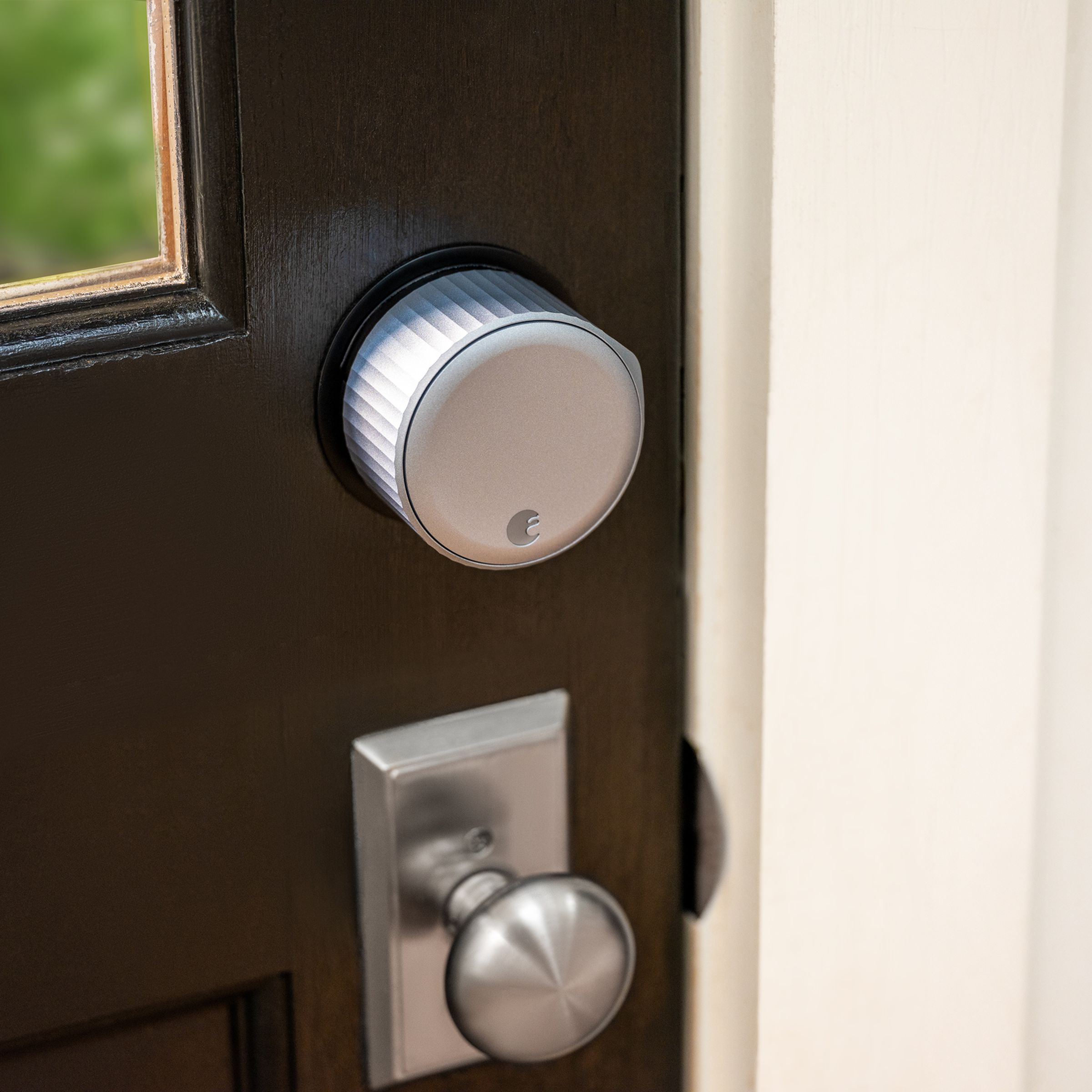 August Wi-Fi Smart Lock installed on a brown door