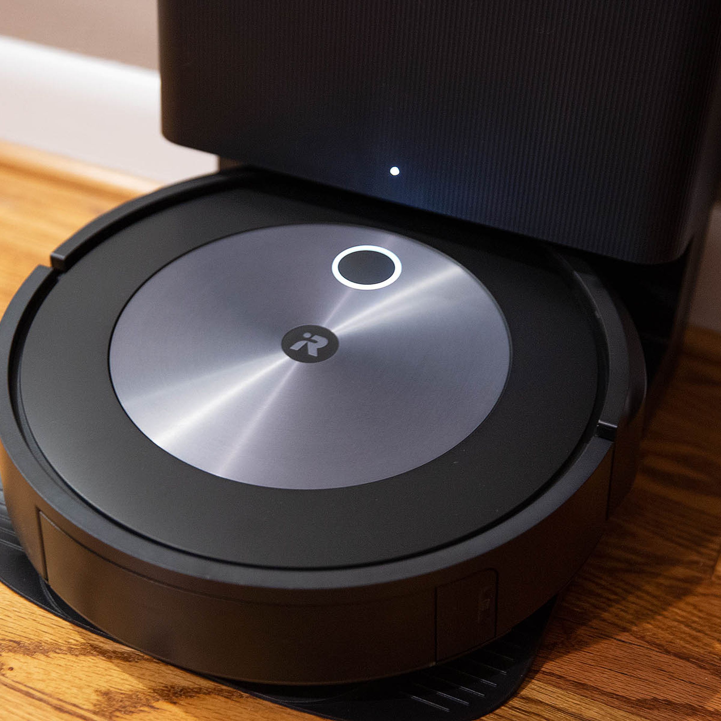 The iRobot Roomba j7 standing up against the wall.