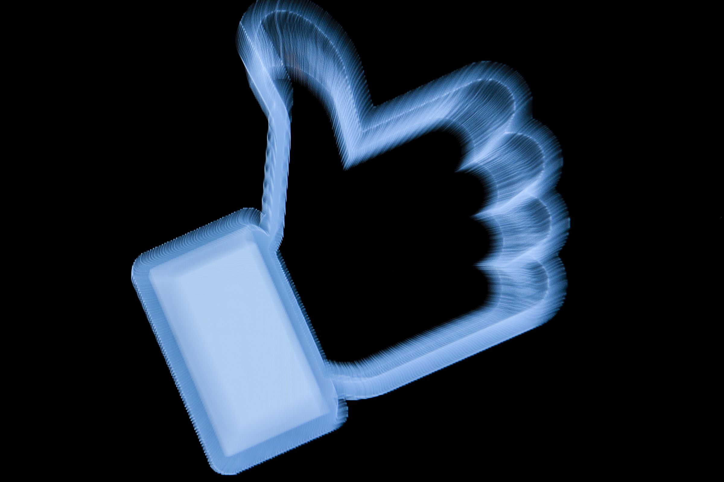 A picture of a neon Like button on Facebook