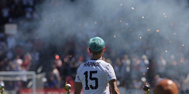 Megan Rapinoe celebrates after a friendly in July 2023