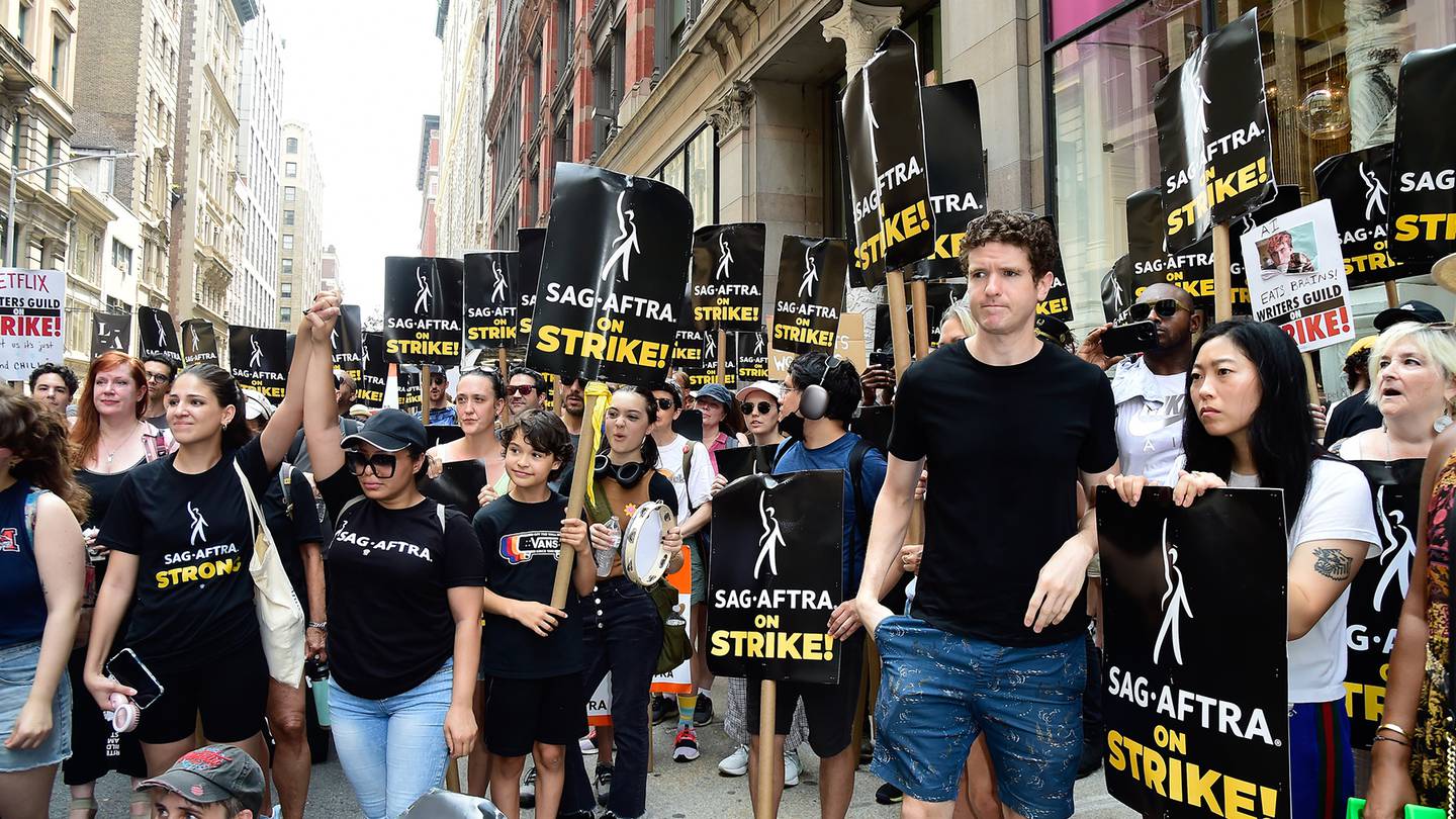 Awkwafina (R) is seen on the picket line during the SAG-AFTRA strike