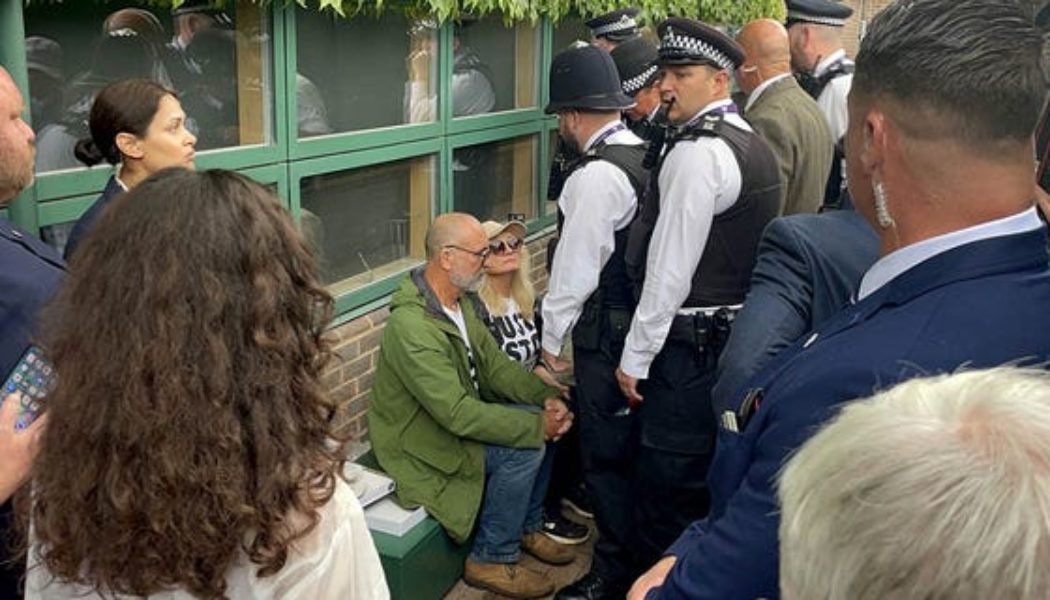 Wimbledon protesters arrested after delaying play with climate change demonstration during men’s singles match