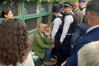 Wimbledon protesters arrested after delaying play with climate change demonstration during men’s singles match