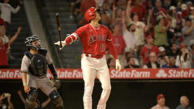 Jul 17, 2023; Anaheim, California, USA; Los Angeles Angels designated hitter Shohei Ohtani (17) flips his bat after hitting a two-run home run in the seventh inning against the New York Yankees at Angel Stadium. Mandatory Credit: Jayne Kamin-Oncea-USA TODAY Sports