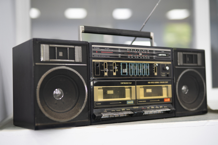 an old cassette recorder, a music center with a radio receiver