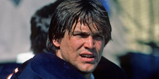 Steve McMichael sits on sideline