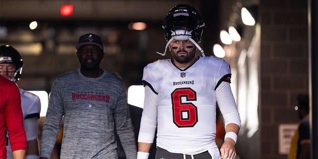 Baker Mayfield walks onto the field