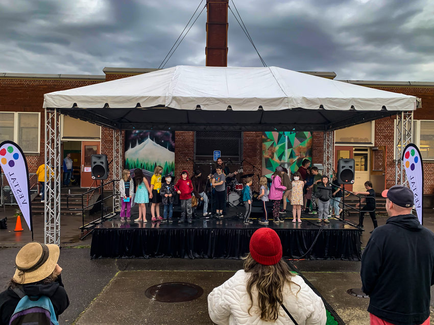 Vestal School students stand on stage as parents and community members watch from the crowd at Social Justice Night.