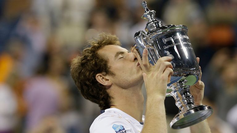 Britain&#39;s Andy Murray poses with the trophy after beating Serbia&#39;s Novak Djokovic in the championship match at the 2012 US Open tennis tournament in New York. Britain&#39;s first male champion at Wimbledon in 77 years will attempt to defend a Grand Slam title for the first time in his career, at the U.S. Open. (AP Photo/Darron Cummings, File)