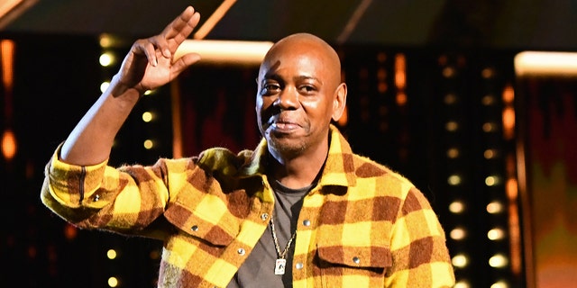 Dave Chappelle on-stage at the Rock and Roll Hall of Fame