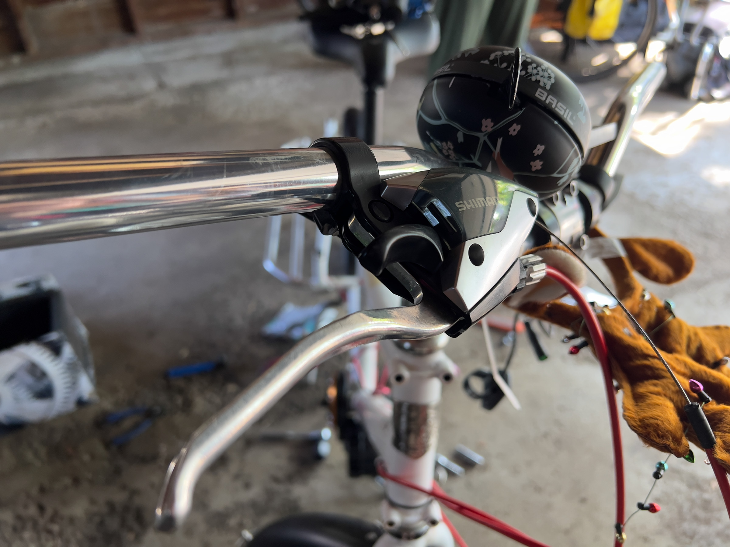 A picture of the brake and shifter. The handlebar grip next to it has been removed. 