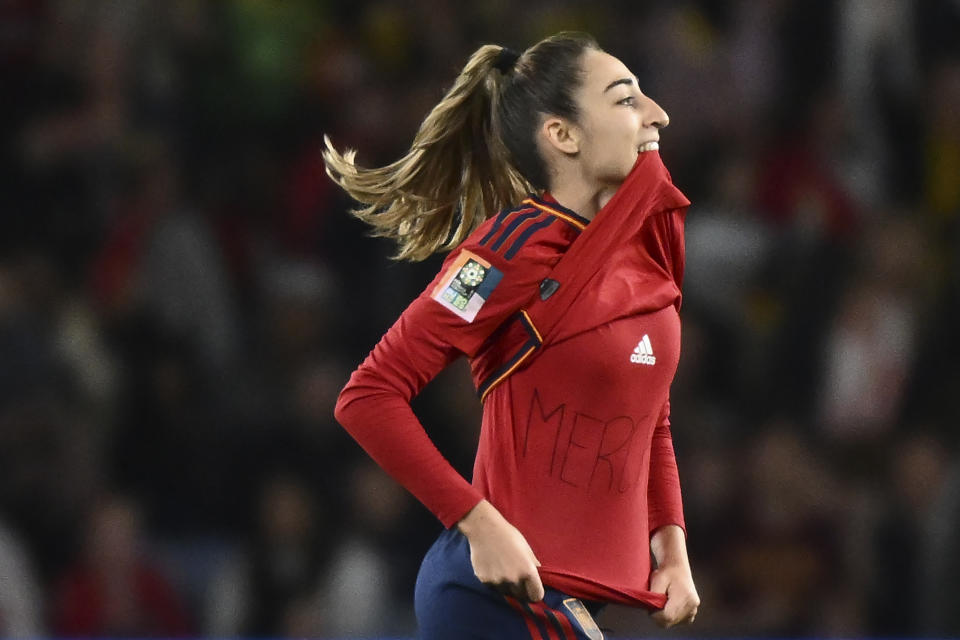 Spain's Olga Carmona, left, celebrates after scoring the opening goal during the Women's World Cup soccer final between Spain and England at Stadium Australia in Sydney, Australia, Sunday, Aug. 20, 2023. (AP Photo/Steve Markham)