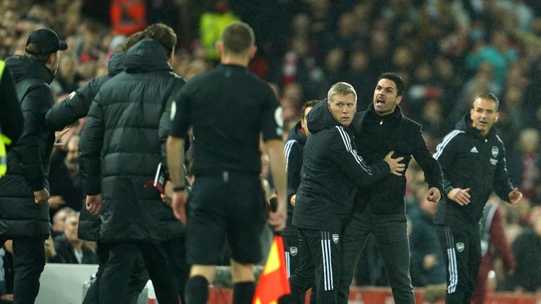 Arsenal&#39;s manager Mikel Arteta, second right, disagrees with Liverpool&#39;s manager Jurgen Klopp, left, during the English Premier League soccer match between Liverpool and Arsenal at Anfield Stadium, Liverpool, England, Saturday, Nov. 20, 2021