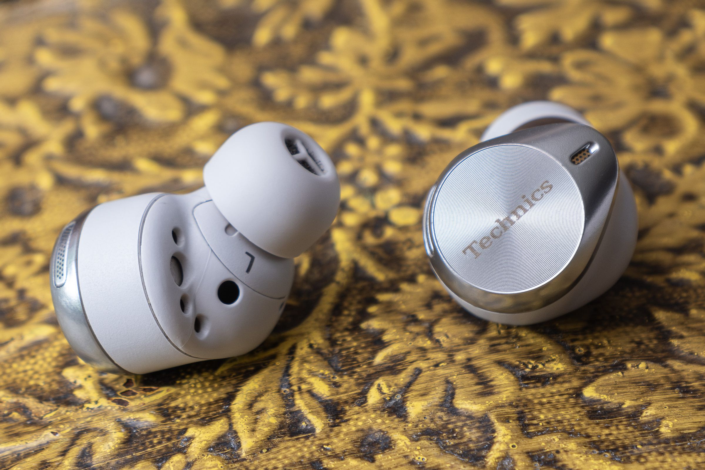 A photo of the Technics EAH-AZ80 earbuds.