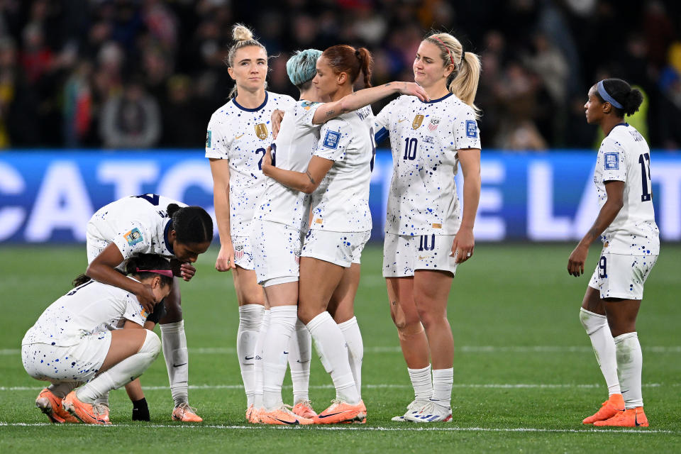 MELBOURNE, AUSTRALIA - AUGUST 06: USA players Trinity Rodman, Megan Rapinoe, Lynn Williams, and Lindsey Horan look dejected after their team was defeated during the FIFA Women's World Cup Australia & New Zealand 2023 Round of 16 match between Sweden and USA at Melbourne Rectangular Stadium on August 06, 2023 in Melbourne / Naarm, Australia. (Photo by Quinn Rooney/Getty Images)