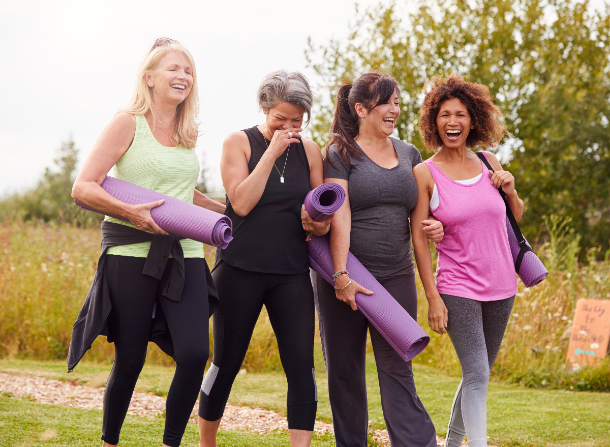 mature yoga friends demonstrating the sneak habits to slow down aging