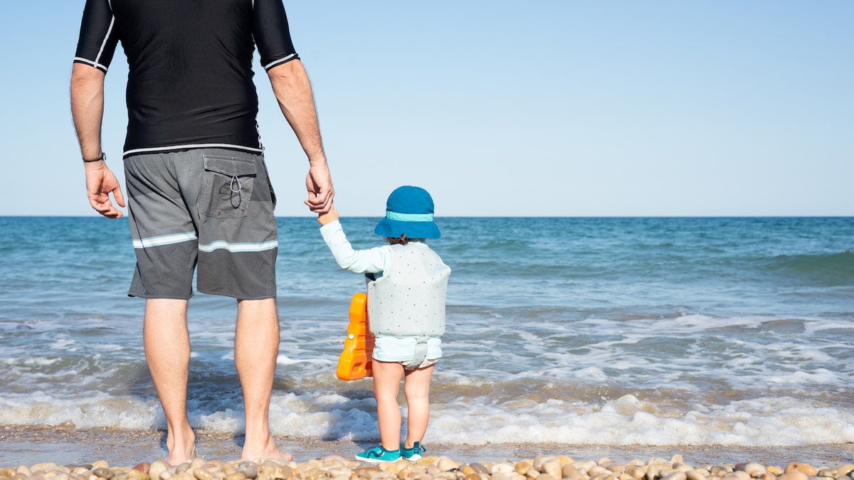 Father and son at beach