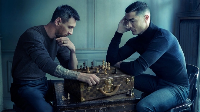 Louis Vuitton campaign featuring Cristiano Ronaldo and Lionel Messi playing a game of chess atop a Louis Vuitton suitcase ahead of the 2022 FIFA World Cup in Qatar.