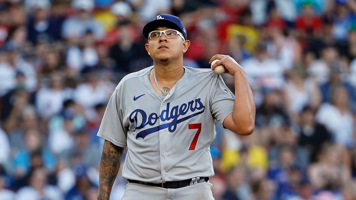 Julio Urias walks on field